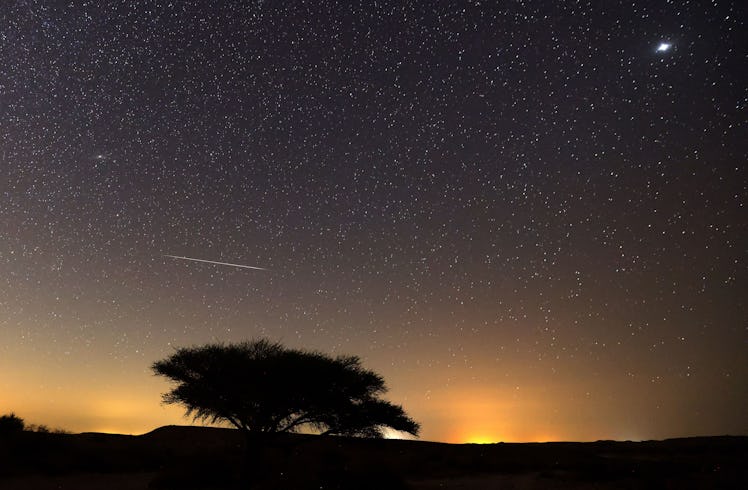 TOPSHOT - A Perseid meteor streaks across the sky above the Negev desert near the Israeli city of Mi...