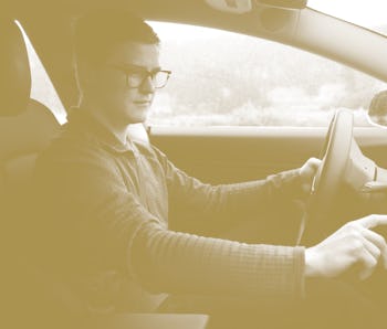 Ross Marabella uses the touchscreen display on the dashboard of his Tesla Model 3 in San Francisco, ...