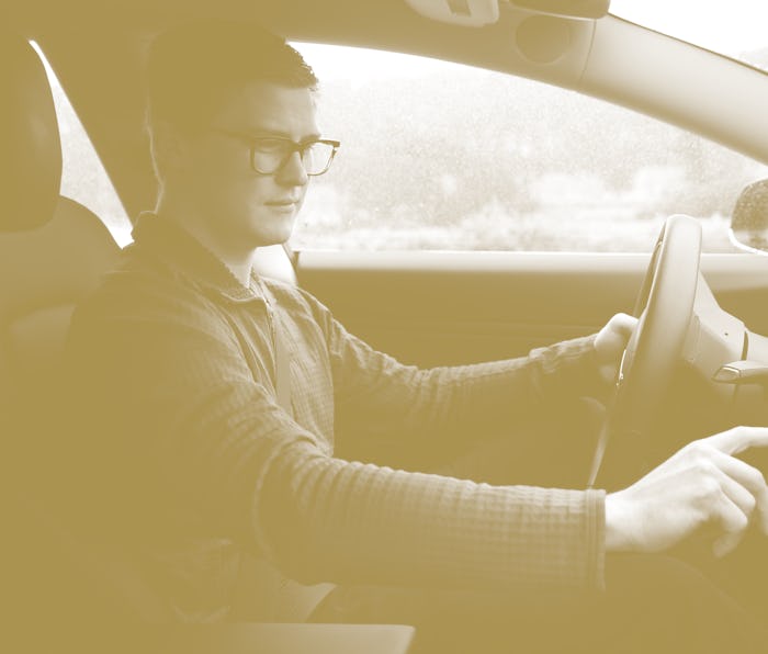 Ross Marabella uses the touchscreen display on the dashboard of his Tesla Model 3 in San Francisco, ...