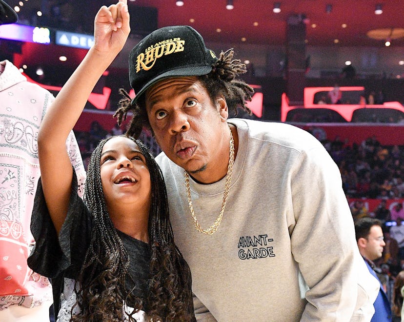 LOS ANGELES, CALIFORNIA - MARCH 08: Jay-Z and Blue Ivy Carter attend a basketball game between the L...