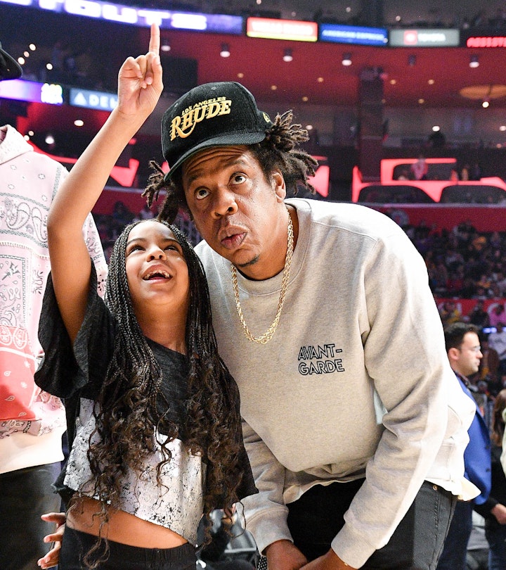 LOS ANGELES, CALIFORNIA - MARCH 08: Jay-Z and Blue Ivy Carter attend a basketball game between the L...