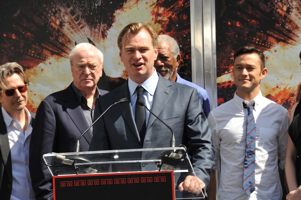 Director, writer, producer Christopher Nolan with fellow cast members from 'The Dark Knight Raises' ...