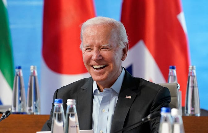 US President Joe Biden smiles at the start of a lunch with Representatives of Seven rich nations (G7...