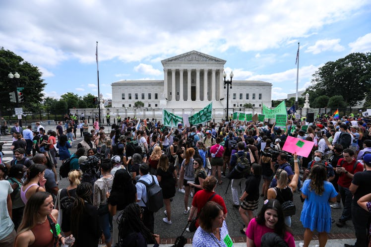 Abortion rights demonstrators holding signs outside the US Supreme Court in Washington, D.C.