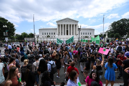 Abortion rights demonstrators hold signs outside the US Supreme Court in Washington, D.C., United St...