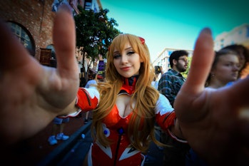 San Diego, California - July 20, 2019: Wide angle view of a female cosplayer grabbing the camera len...