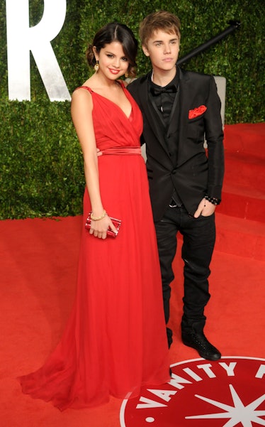 Selena Gomez and Justin Bieber arrive at the Vanity Fair Oscar Party 2011