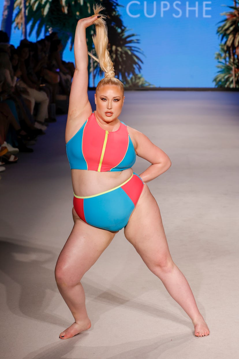 Hayley Hasselhoff in a pink, blue, and yellow swimsuit