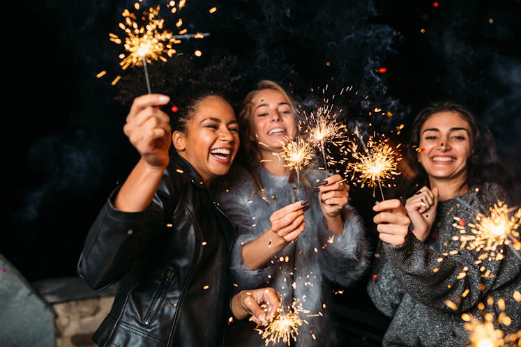 Friends with sparklers use 4th of July captions for their Instagram pics.