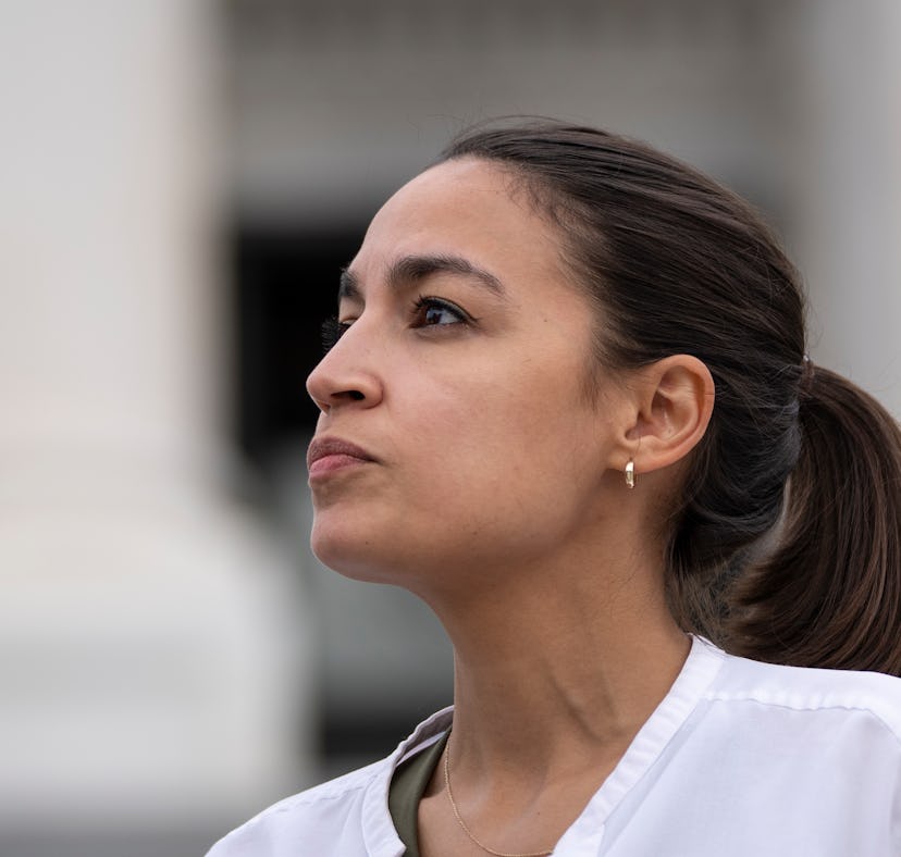 WASHINGTON, DC - AUGUST 03: Rep. Alexandria Ocasio-Cortez (D-NY) talks with a reporter as she protes...