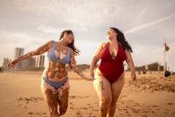 Friends holding hands walking in the beach. Here's your july 21 zodiac sign daily horoscope.