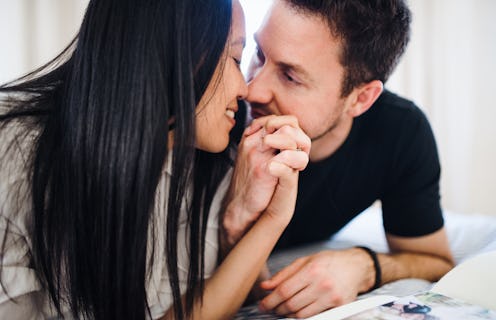 A young woman and man spending time together indoors.