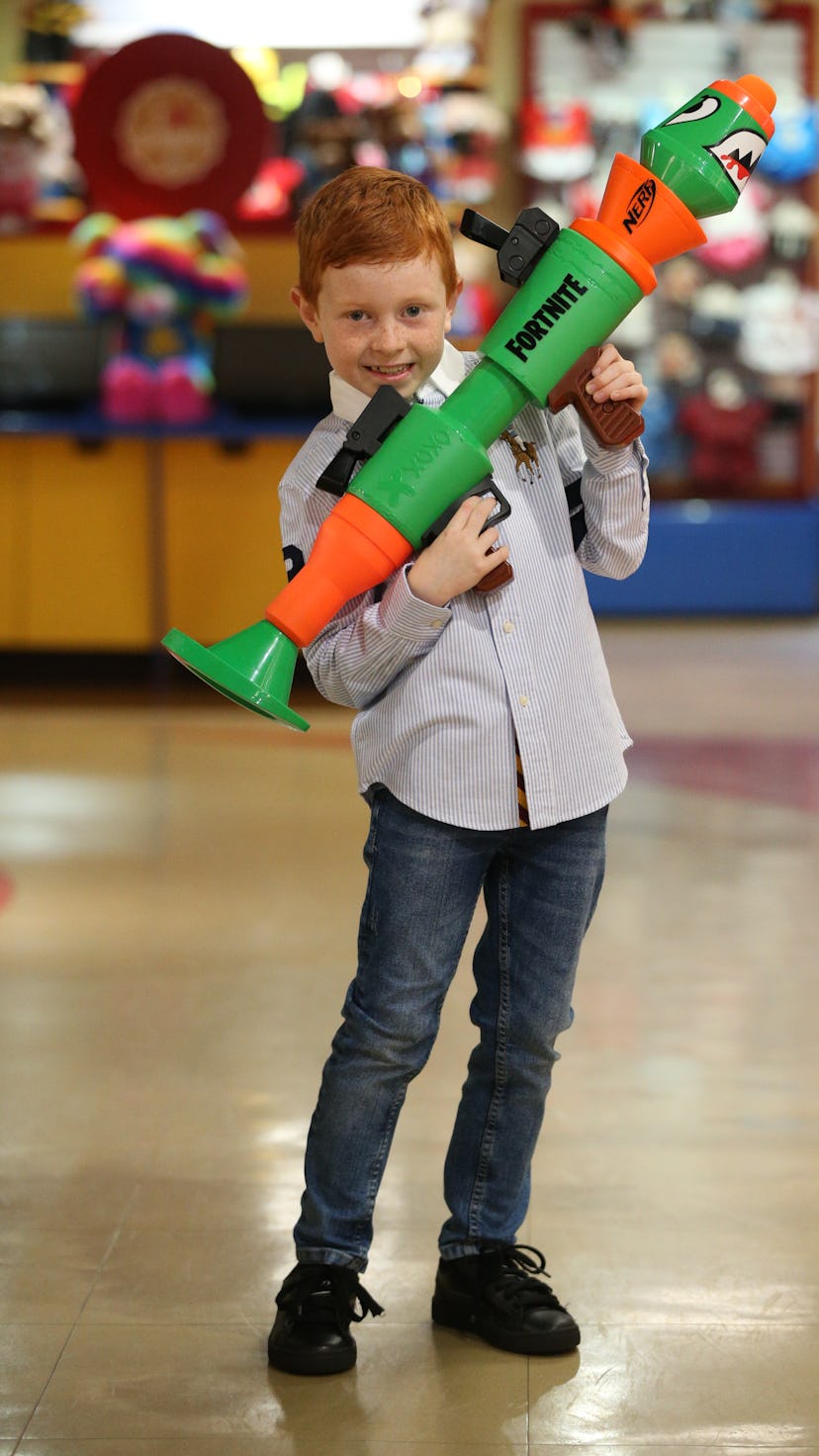 Auston Robertson-Jeyes plays with the new NERF Fortnite IRL during the Hamleys Christmas toy showcas...