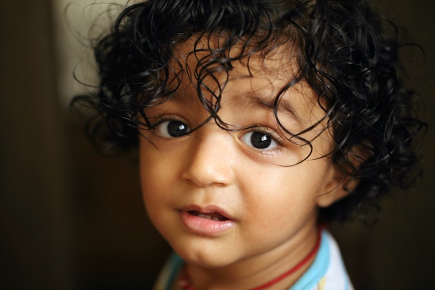 Headshot of adorable baby boy in an article about boy names that start with M