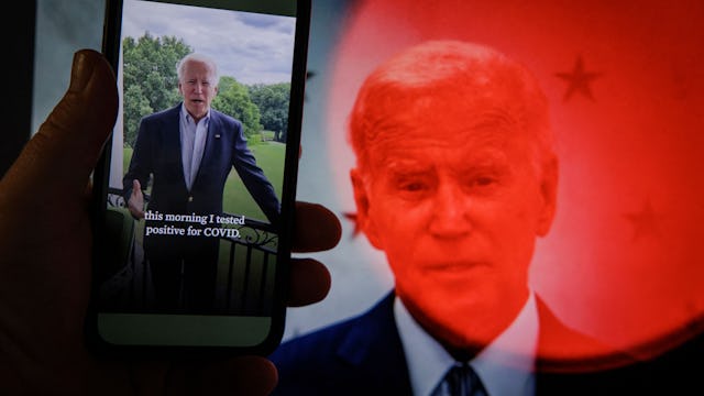 In this photo illustration taken on July 21, 2022 in Washington, DC, a video tweet from US President...