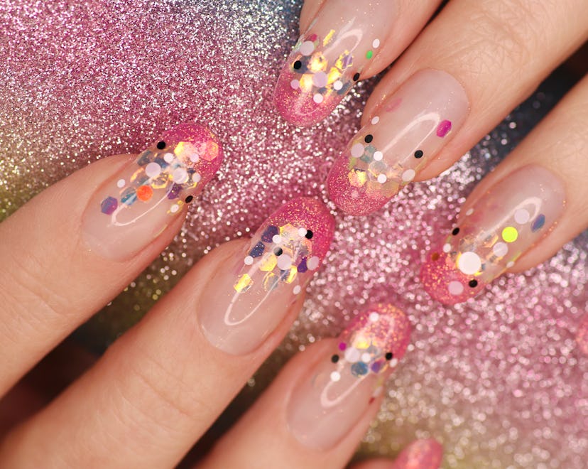 A bold and beautiful Leo birthday nail design with pink glitters 