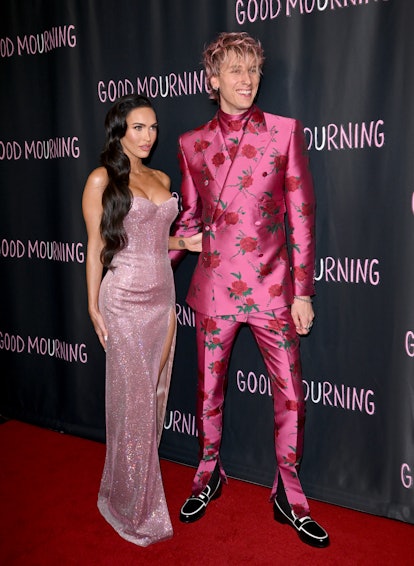 Megan Fox and Machine Gun Kelly wearing pink outfits at the World Premiere of "Good Mourning" in may...