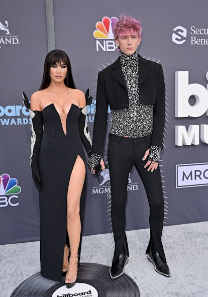 Megan Fox and Machine Gun Kelly in black looks at the 2022 Billboard Music Awards 