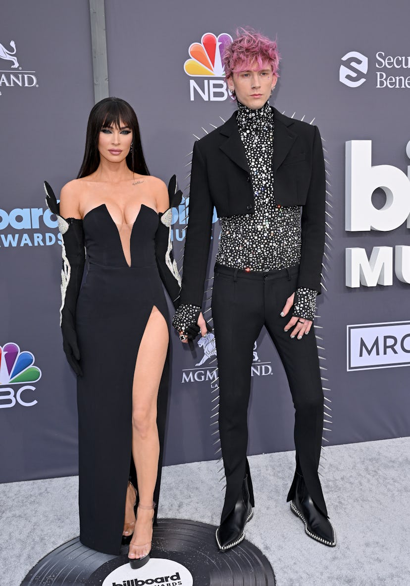 Megan Fox and Machine Gun Kelly in black looks at the 2022 Billboard Music Awards 