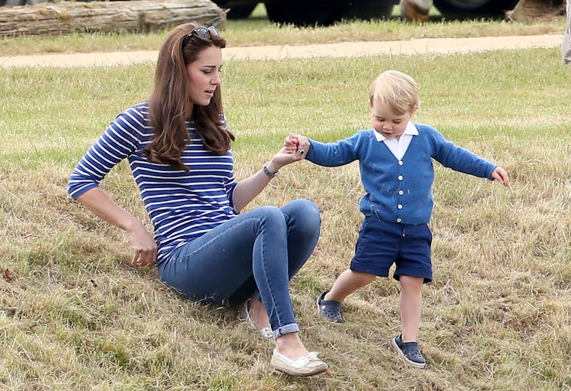 Prince George lends his mom a hand.