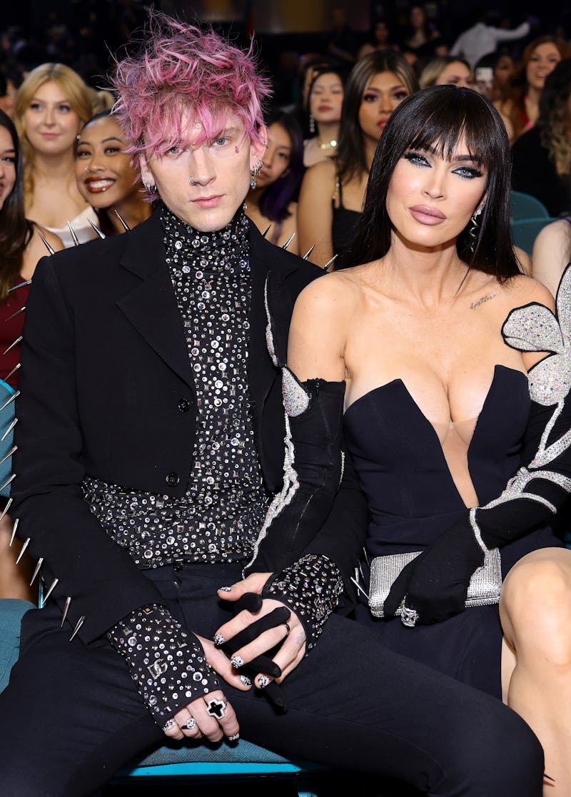 Machine Gun Kelly and Megan Fox wearing black embellished looks at the 2022 billboard music awards