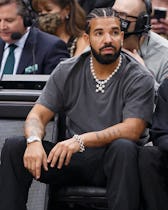 TORONTO, ON - MARCH 18: Rapper Drake reacts at the NBA game between the Toronto Raptors and the Los ...