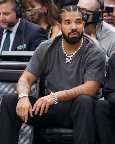 TORONTO, ON - MARCH 18: Rapper Drake reacts at the NBA game between the Toronto Raptors and the Los ...