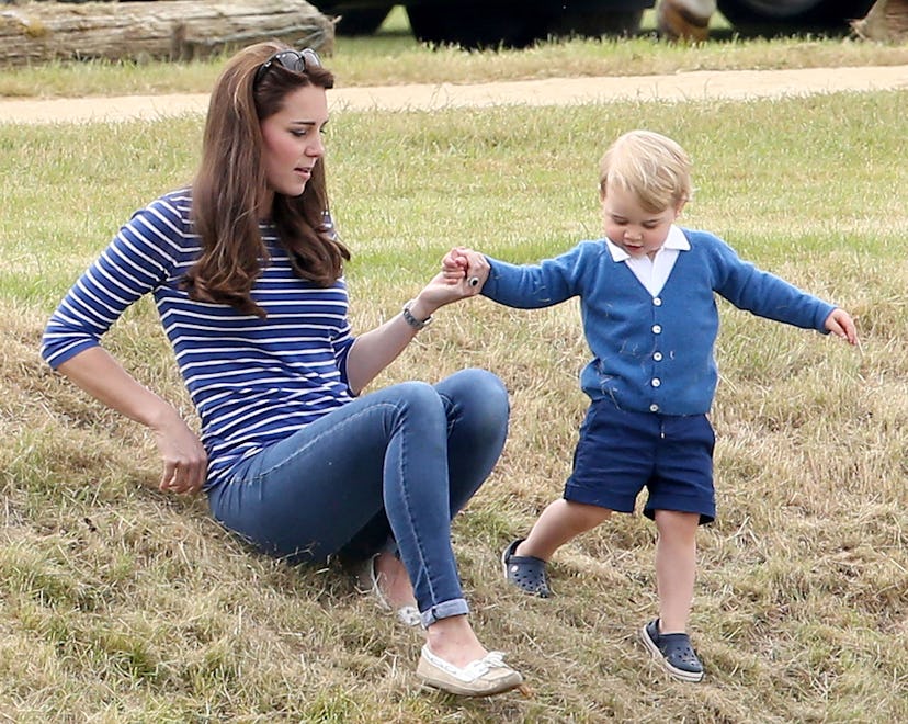 TETBURY, ENGLAND - JUNE 14: Catherine Duchess of Cambridge and Prince George attend the Gigaset Cha...