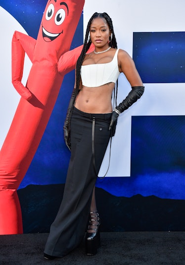 Keke Palmer in a cropped white corset top and a long black skirt at the "NOPE" premiere