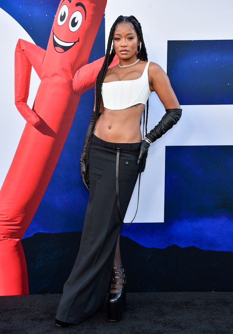 Keke Palmer in a cropped white corset top and a long black skirt at the "NOPE" premiere
