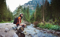 Shot of a young woman hiking in nature.  These are the 4 most independent zodiac signs.