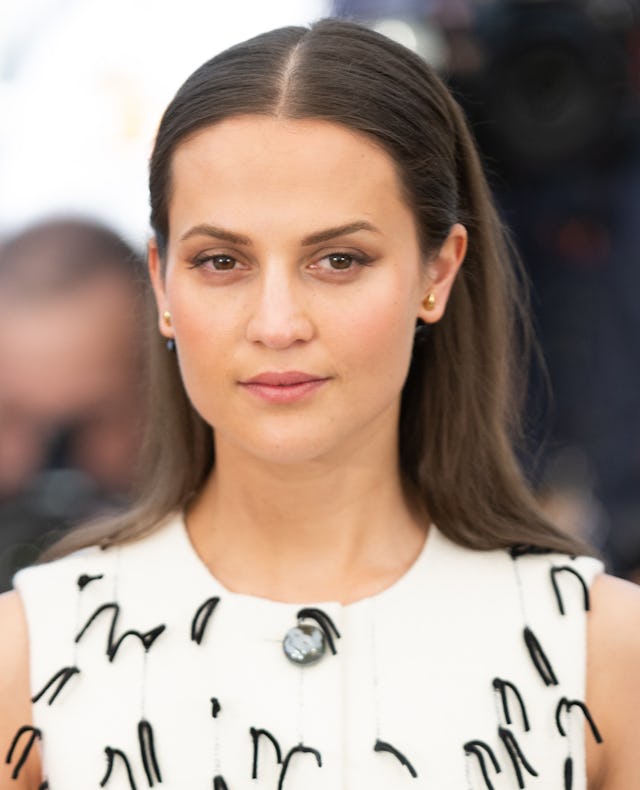 Alicia Vikander shares her miscarriage story. Here, she attends the photocall for "Irma Vep" during ...