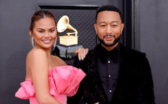 LAS VEGAS, NEVADA - APRIL 03: (L-R) Chrissy Teigen and John Legend attend the 64th Annual GRAMMY Awa...