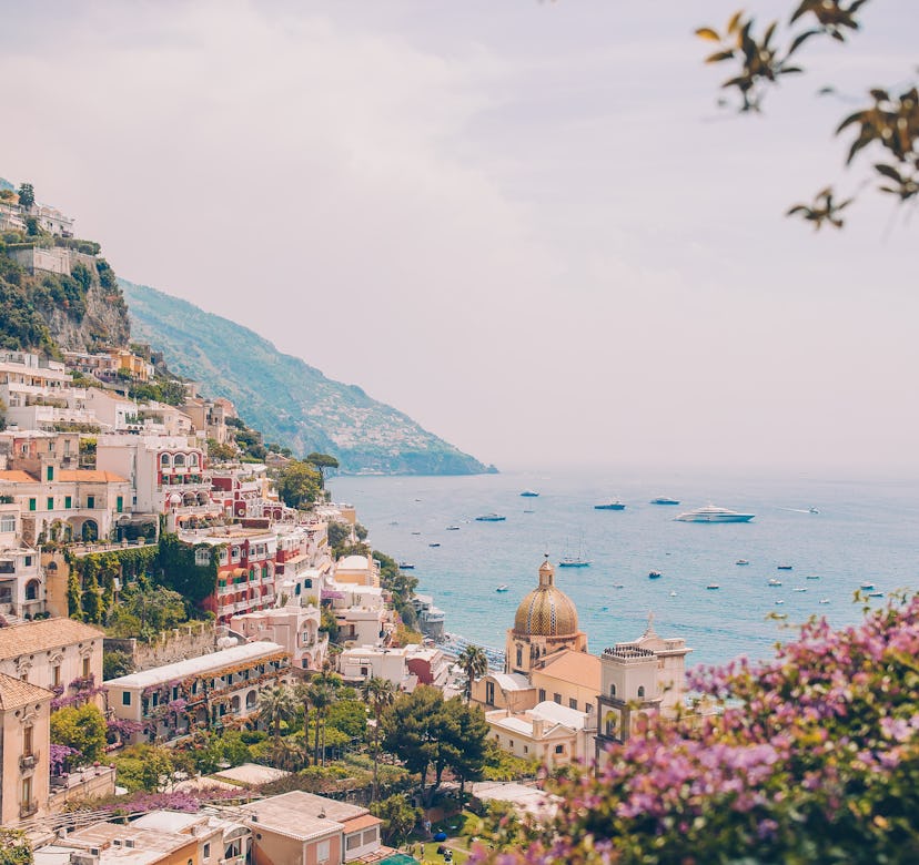 View of the town of Positano with flowers on Amalfi coast