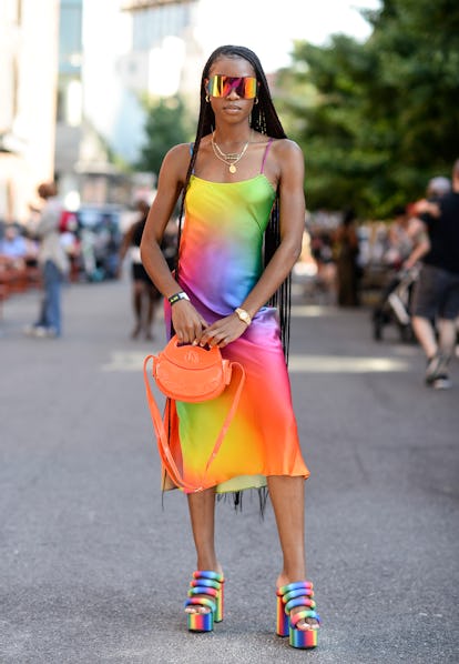 NEW YORK, NEW YORK - JUNE 25: Pierrah is seen wearing Bruce Glen dress and orange Homage Year bag ou...