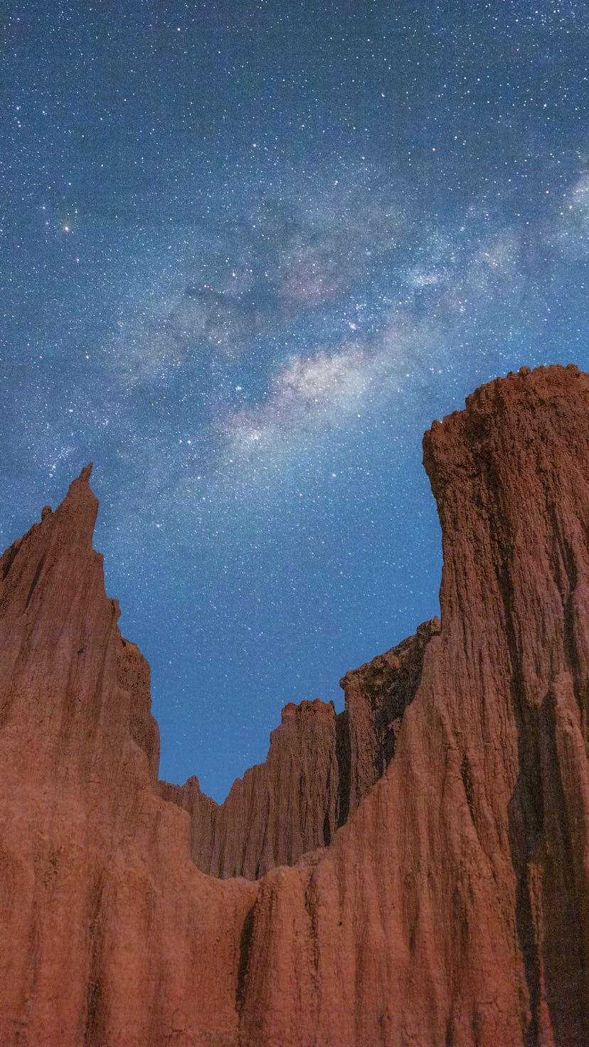 Grand canyon cliff erosion hill of soil with Milky way. Jupiter retrograde 2022.