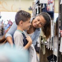A mother and her son shopping for back-to-school clothes. 18 states have tax-free weekends coming up...
