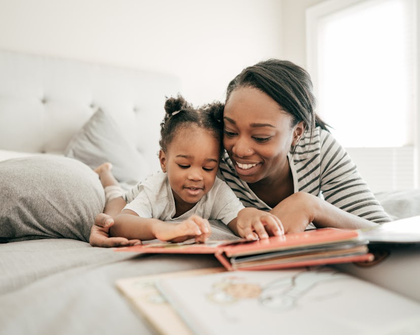 Mom reading to her young child in an article about sight words and what are sight words.