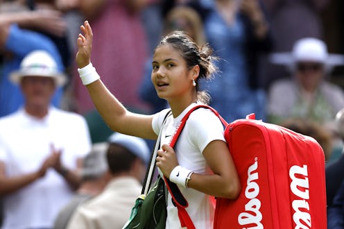 Great Britain's Emma Raducanu applauds the spectators after defeat in the second round match against...