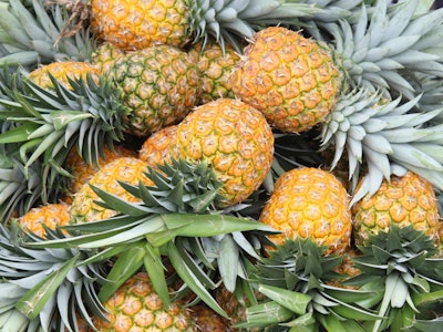 Pineapples piled on top of one another 