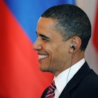 US President Barack Obama smiles as he seats to have lunch with his Russian counterpart Dmitry Medve...