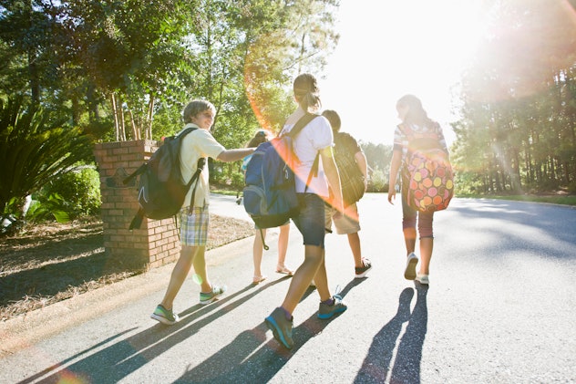 kids walking to school in the sunlight in an article about back-to-school instagram captions 