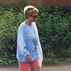 LONDON, ENGLAND - AUGUST 24: Diana, Princess of Wales, wearing a pale blue sweatshirt, pink cycling ...
