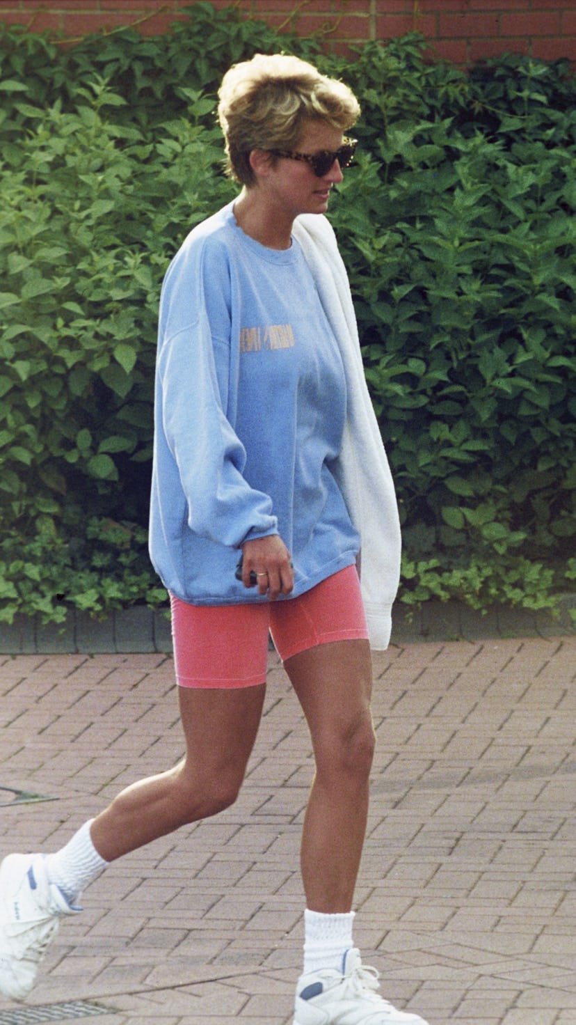 LONDON, ENGLAND - AUGUST 24: Diana, Princess of Wales, wearing a pale blue sweatshirt, pink cycling ...