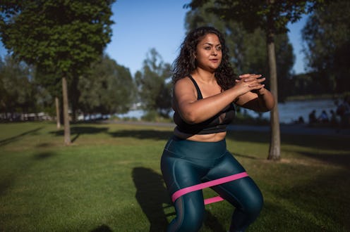 Trainer-approved resistance band hamstring exercises to try on your next leg day.