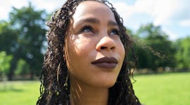 young woman enjoys her time at a park as she thinks about her august 8, 2022 weekly horoscope