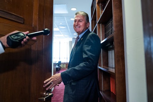 UNITED STATES - JULY 19: Chairman Sen. Joe Manchin, D-W.Va., talks with the media outside the Senate...