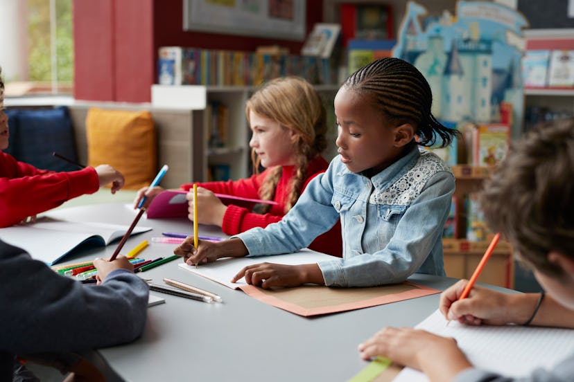 children studying at school in a round up of Instagram captions for the first day of first grade.