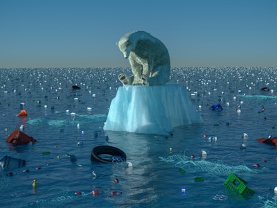 High resolution digital image depicting a single, sad, dirty polar bear, floating on a dwindling chu...