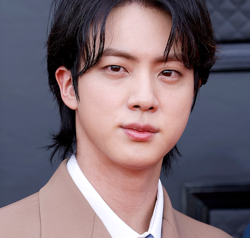 Last year, Jin revealed on Instagram that he got this same tattoo as the rest of BTS.